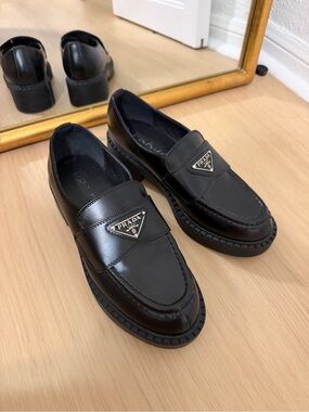 Prada Black Leather Platform Penny Loafers with Metal Logo